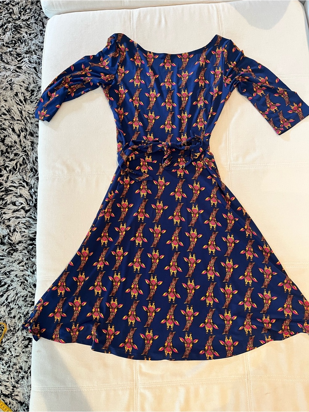 Leota Navy Dress with Pink and Gold giraffe pattern. So Unique and flattering